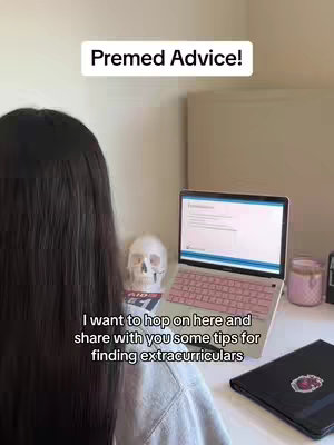 The cover image shows a person sitting at a desk, viewed from behind the head.  They face a laptop open to a document on a white desk. Beside the laptop is a human skull, and to the side a candle. The text overlay appears in the upper and lower parts of the image.