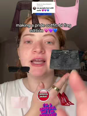 A selfie-style video cover featuring a light-skinned person with red hair in front of a blurred background. Various clothing and accessory items are floating in front representing a bi pride outfit. Text overlays includes a speech bubble, a phrase in the center, and graphics.