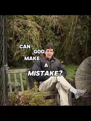 A man sits on a wooden bench outdoors with a natural background of foliage. Text overlays the image. The man is dressed in a jacket, light-colored pants, and sneakers, with his legs crossed. The text asks, "CAN GOD MAKE A MISTAKE?"