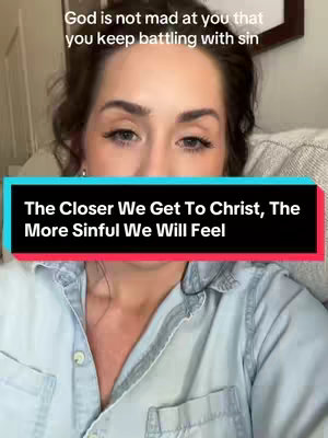 A woman with light skin and dark hair is centered in the frame. She wears a light blue button-down shirt. Above her, a text overlay states, "God is not mad at you that you keep battling with sin.". Below her, a text overlay in a red and black rectangular box reads, "The Closer We Get To Christ, The More Sinful We Will Feel."