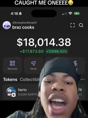 A screenshot of a mobile app interface showing a financial gain. The creator, a Black man with dreadlocks and a black beanie, is in the foreground with an excited facial expression. He appears to be recording a selfie video. The app displays a balance of $18,014.38, with a gain of $17,873.60 and a percentage increase of +12696.42%. Additional app features are visible, including buttons for "Receive" and "Send", and a section for "Tokens" and "Collectibles".