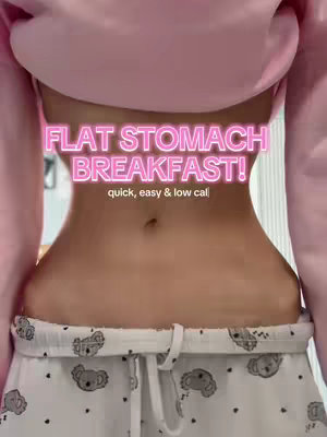 A selfie-style shot focusing on a person's midriff, framed from slightly below the chest to above the hips, with a pink hoodie and white patterned pajama bottoms featuring koala prints. The skin tone is light, and the stomach appears toned. Text overlays are positioned above the stomach, offering a promise and description of the video's content.