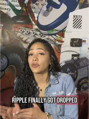 A woman with long, dark curly hair is speaking to the camera, with a denim jacket and necklace. She appears to be gesturing towards the bottom of the screen, where a caption is visible. The background consists of a collage made of print-style wallpaper and artwork. The color palette is dominated by blue, tan, brown, and red.