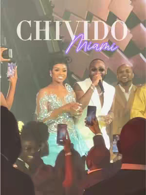 The cover image shows people attending a wedding at a venue lit with stage lighting. The main subjects are a couple, the bride and groom, with the woman in the dress and man in a suit holding microphones. The overall colors are warm, with gold and pink stage lights.