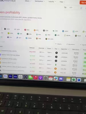 A laptop screen displaying a website with data related to cryptocurrency mining profitability. The screen shows detailed values and a logo. The keyboard of the laptop is visible in the bottom part of the image. The overall color scheme is light.