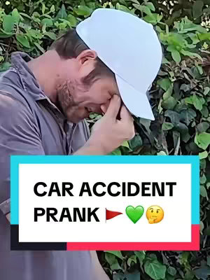 The cover image shows a man looking down, covering his face with his hand, wearing a white baseball cap and a grey shirt. The background is blurry, showing a green foliage. At the bottom of the image, there is a blue rectangular box with the text 'CAR ACCIDENT PRANK' with emojis and a flag icon.