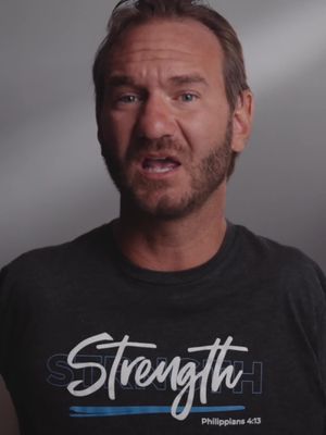The cover image features a middle-aged man with a beard and short brown hair looking directly at the camera with a serious expression. He is wearing a dark gray t-shirt with the word "Strength" written across the front in a stylized, white font, with the phrase "Philippians 4:13" underneath. The background is a plain gray.
