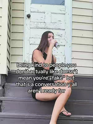 A young woman sits on wooden steps in front of a white door, holding a can to her mouth as if drinking. Overlay text appears on the image.