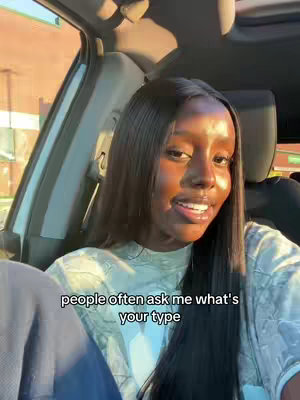 A selfie taken from inside a car. A young Black woman with long, straight hair is looking at the camera and smiling slightly. The text overlay says, "people often ask me what's your type."