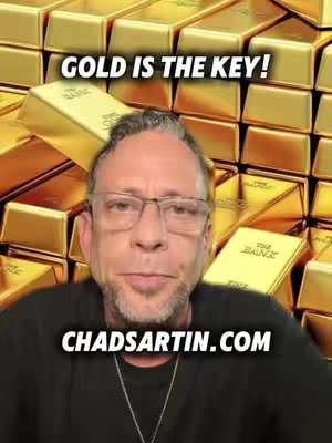 A man with glasses stands in front of a backdrop of gold bars. Overlaid at the top is white text that reads 'GOLD IS THE KEY!' and at the bottom, 'CHADSARTIN.COM' is written in white. The man is looking at the camera.