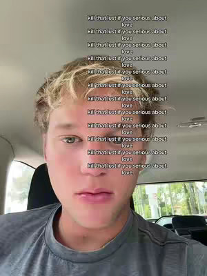 A selfie-style shot focused on a young man's face. Above his head, a series of vertically stacked texts in white font repeat the phrase 'kill that lust if you serious about love.' The man has light-colored hair and is wearing a grey t-shirt.