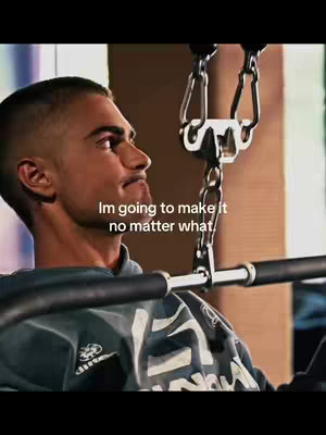 A man in a grey sweatshirt is seen from the side, looking up with a determined expression, in what appears to be a gym. The text overlay reads, 'Im going to make it no matter what.'