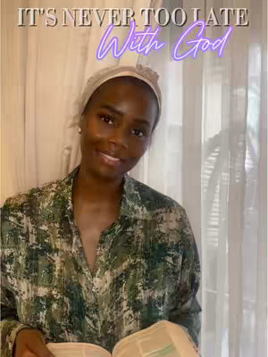 A woman with dark skin and a headscarf is smiling at the camera while holding a book. Text overlays the image.