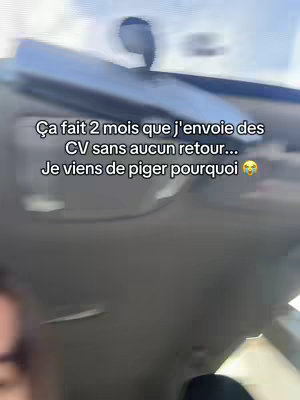 The image shows a selfie taken from inside a car, with a slightly blurry background. On the screen, there's text overlayed in white, describing the creator's struggle to find a job. The text is formatted with a casual tone on a white background. The selfie framing is from a low angle looking up at the upper part of the car and the creator's face, angled towards the car's ceiling and window. The overall composition is simple, with the text being centered.