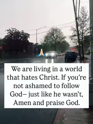 The cover image shows a rainy street scene. In the background, there are cars driving on a wet road. A text box on the bottom contains a religious message. Above the text box is a sign of praying hands.