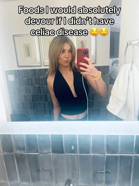 The cover image is a selfie taken in a bathroom. The woman is the central focus, positioned in front of a mirror. Above her, text overlays the image. The background shows a bathroom with a dark tiled wall and accessories like a towel rack. The woman holds a phone, and the composition is a typical mirror selfie.