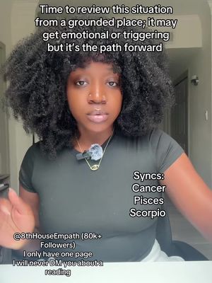 A selfie-style video cover image featuring a Black woman with dark, curly hair. She is looking directly at the camera with a serious expression. Text overlays include words like 'Time to review...' and astrology-related terms such as 'Cancer, Pisces, Scorpio,' suggesting a focus on self-reflection or astrology. The background is plain, suggesting a simple setting.