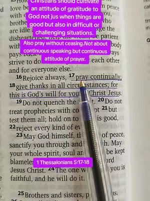 The image shows an open bible with a pen pointing at a highlighted passage, text is in purple highlighting on the paper. The focus is primarily on the text relating to prayer and gratitude.