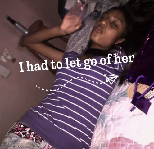 A young woman lies on a bed, partially draped in a purple-striped shirt. The scene is lit with soft, warm light, and a purple bag sits in the corner. Text overlays read, 'I had to let go of her,' with a paper airplane graphic, indicating the video's tone.
