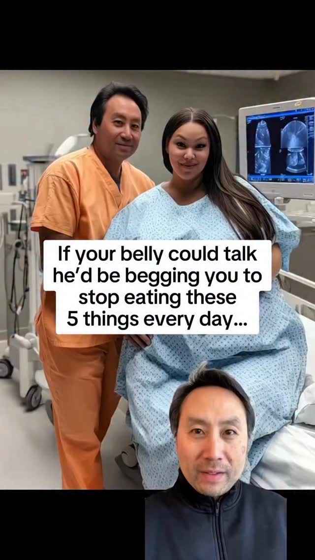 The image is a selfie-style shot. In the background, there is a man in orange scrubs and a person in a hospital gown. In the foreground, there is a man wearing a black sweater. A text overlay is placed in the center with white text on a black background.