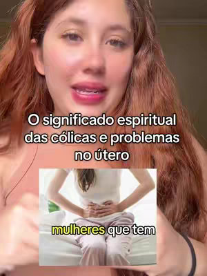A woman with light skin and red curly hair looks at the camera. Text over the woman's face reads, 'O significado espiritual das cólicas e problemas no útero'. Below the text is a thumbnail image of a person holding their stomach. The words 'mulheres que tem' are written in a box below the thumbnail.