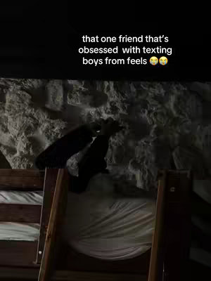 The image is a dimly lit interior shot featuring a bunk bed. The upper bunk is visible with a white sheet, beneath which, a ladder of wooden planks leads downward. A person is implied by the extended arms. The upper portion of the scene shows the headboard of the bunk bed, with the added text at the top.