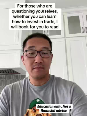 A man with glasses is centered in the frame, set against a backdrop of white cabinets. Above him, a white box contains text that is likely the hook. Underneath, a green and white text box reads "Education only. Not a financial advice."