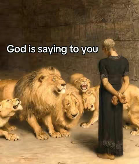 The image shows a painting-like scene with a person standing before several lions. Text overlayed on the image says "God is saying to you". The person is standing facing the lions, their back to the viewer. There are multiple lions, some are roaring. The colors are muted, with a focus on browns and golds.