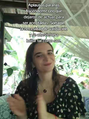 A woman with long hair is clapping her hands in front of what appears to be a patio with plants in the background. Text overlayed on the image expresses a message.