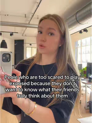 A selfie-style video cover image shows a young woman holding a phone in front of her as she looks into the camera, with text overlayed on the bottom.