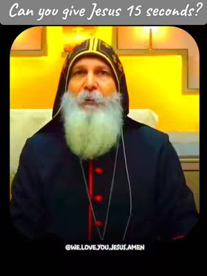A man with a long white beard and a black robe is centered in the frame. Above his head is a text overlay on a black background. The background is yellow. A text overlay at the bottom also has text on a black background