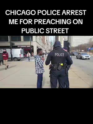 A young black man in a plaid shirt is being questioned by two Chicago police officers on a city street. The officers are wearing dark uniforms with police badges. The background shows buildings, other people, and a vehicle.