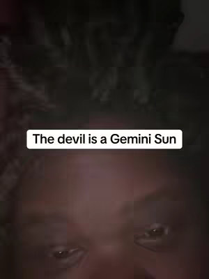 The cover image shows a close-up of a person's face, with the eyes in sharp focus. Above their face, a text overlay reads 'The devil is a Gemini Sun'.  The image is dark, with muted tones.