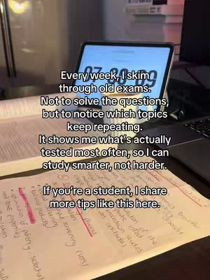 The image shows a desk setup with a tablet displaying a timer, open books, and handwritten notes. Text overlays provide study tips, emphasizing reviewing old exams to identify recurring topics for smarter studying. The overall color scheme is warm, with a focus on the white and blue of the tablet screen.
