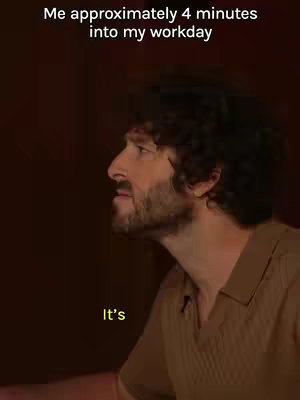 A man with curly hair and a beard looks off-camera, likely in contemplation, with text overlays on the image.