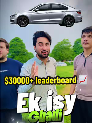 The cover image showcases three men, with one in the center gesturing towards the viewer. Above, there's a silver car, and text overlays at the bottom highlight key phrases like '$30000+ leaderboard' and 'Ek isy Ghadi'. The background features a green landscape.