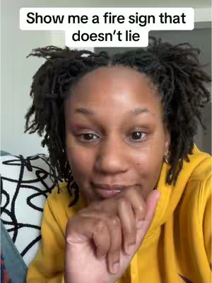 The cover image shows a close-up of a woman with dark, short, curly hair, wearing a yellow hoodie. She is positioned in front of what appears to be a simple, light-colored background. The woman is looking directly at the camera, conveying a thoughtful or inquisitive expression, with her hand near her mouth. Text is overlayed at the top in a white font.
