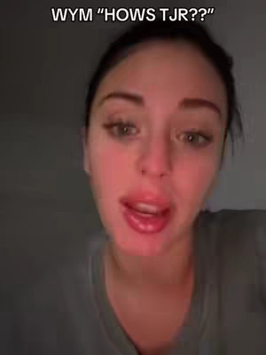 A close-up shot of a woman looking at the camera and speaking, with text overlay at the top.