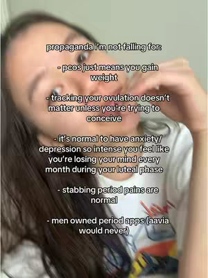 A selfie-style image focuses on a woman's upper body and face. She’s positioned off-center, angled slightly towards the top-right corner. The background has a plain, light-colored wall and a muted ambiance. The woman is wearing a white top. Overlaid text lists various opinions about women's health issues, with a playful reference to a period tracking app at the end.