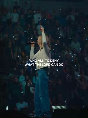 The cover image features a female speaker on stage, holding a microphone and pointing upwards, with a blurred audience in the background. Text overlayed says, "WHO AM I TO DENY WHAT THE LORD CAN DO". The image is lit with stage lighting creating a dramatic feel.