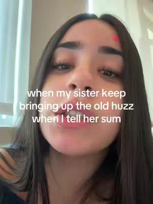 A selfie-style shot featuring a young woman. The image focuses on her face, with her skin tone appearing fair. The woman has dark hair and a facial expression indicating a mix of emotions. A red dot is visible on her forehead. Text is overlaid on the image, adding context or a caption to the scene.
