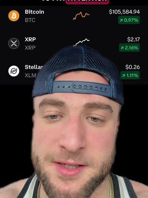 A selfie-style video cover image featuring a man looking down towards the camera. The upper portion of the image shows a cryptocurrency data display with real-time values for Bitcoin, XRP, and Stellar, and an overlaid hook that reads 'PAY ATTENTION'.