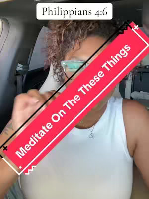 A woman with curly hair and glasses, wearing a white top, is sitting in a car. A red banner with the text "Meditate On These Things" is superimposed diagonally across the image. Above the banner, the text "Philippians 4:6" is visible.
