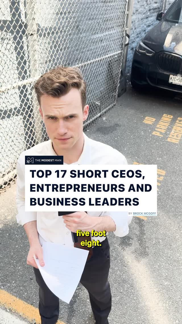 A man wearing a white dress shirt and black pants is standing outside on a gray surface, holding a paper. Behind him is a chain-link fence and a partially visible black car. Text overlays read 'TOP 17 SHORT CEOS, ENTREPRENEURS AND BUSINESS LEADERS' and 'five foot eight.'