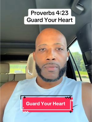 A man with a shaved head is in a car, looking straight ahead with a serious expression. Text overlays read 'Proverbs 4:23 Guard Your Heart' above and 'Guard Your Heart' below.