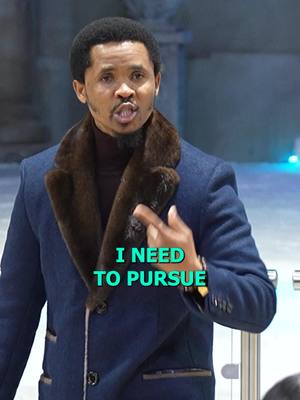 A man in a blue blazer with a fur-trimmed collar is speaking. Text overlay 'I NEED TO PURSUE' is displayed in a bright green box.