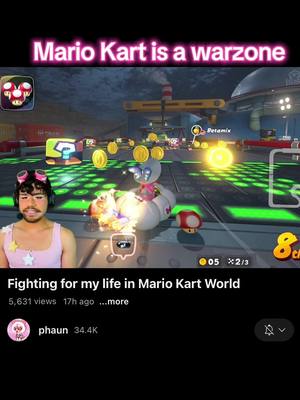 The cover image shows a split-screen view from a video game, depicting a player character from Mario Kart in a race, along with the face of the creator, who has pink-framed glasses and headphones as well as a pink top. Overlayed on the image is the title "Mario Kart is a warzone." The game screen shows a racetrack scene with the player's kart, other racers, and various in-game items filling the frame, creating a chaotic appearance. The creator’s face is on the left, looking at the camera.