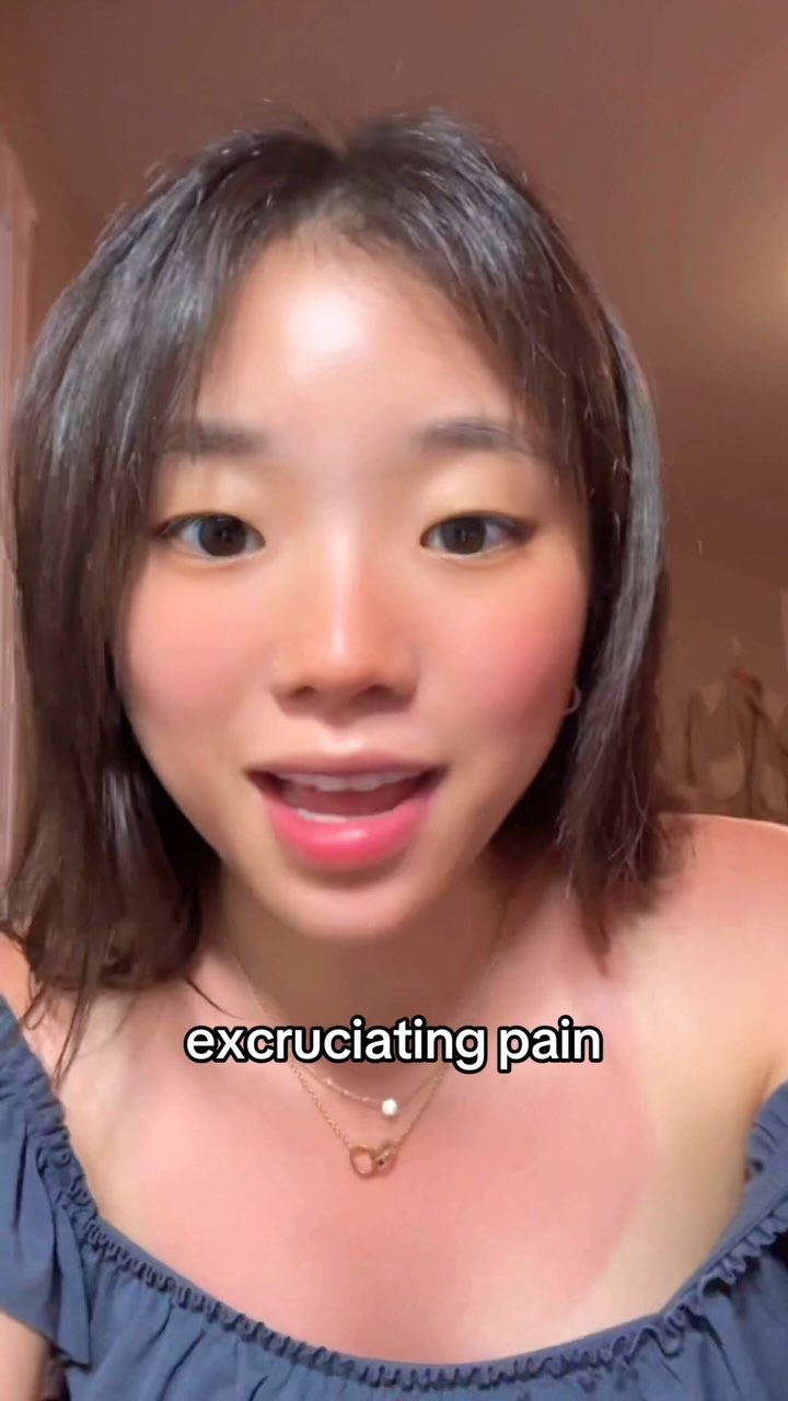 The cover image is a close-up shot of a young woman with dark hair and fair skin. She appears to be indoors, possibly in front of a wall. The top part of her shoulder is bare, with a tan-line and some redness. Her gaze is fixed on something outside of the camera.