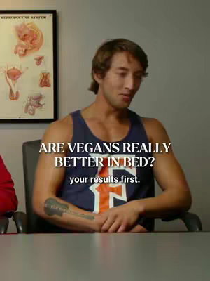 The image shows a man in a blue tank top with text overlay on it. The man is seated in an office chair, a portion of what appears to be a medical chart is visible on the left side of the background. The man looks toward the camera and has text overlayed on the image in a white font.  