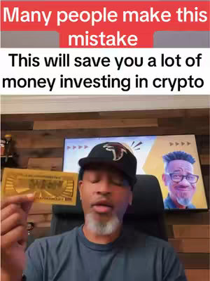 The cover image is a selfie-style shot featuring a Black man in a black cap, holding a gold item that resembles a card or a bill. The upper part includes a red background with white text:"Many people make this mistake". Below that, the white text says: "This will save you a lot of money investing in crypto". A TV behind him displays a digitally created portrait of a man, next to an animated, gold-colored design. The background is a wood paneled wall. The man is wearing a black t-shirt with a black cap and a beard.